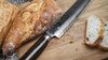 
                    Tim Mälzer bread knife with hammer stroke surface